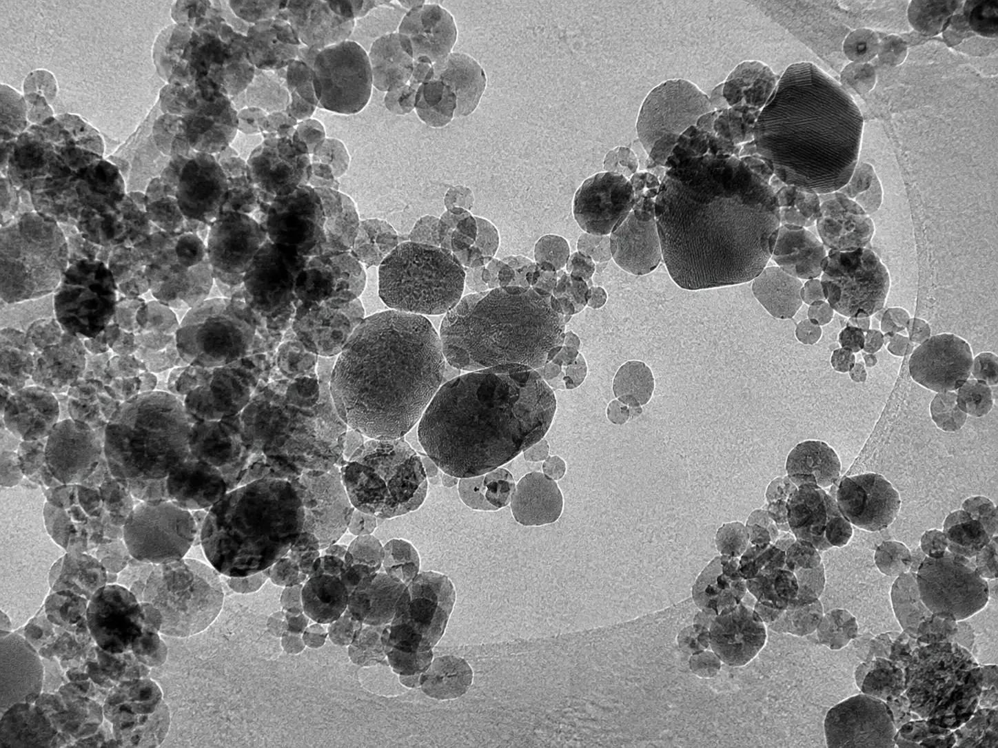 Bright-field TEM micrograph showing nanoparticles and particle agglomeration