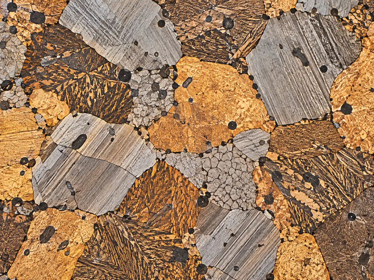 Metallographic micrograph of a polished and etched metal section showing grains and phases